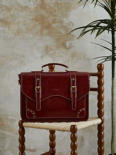 Upgrade your style and convenience with our sleek,Wilder Vintage 15.6-Inch Briefcase, featuring a double buckle flap with stud accents, textured glossy PU leather, a 15.6-inch padded compartment, and multi-carry options for all your daily needs. Upgrade Your Style, 6 Inches, Your Style, Pu Leather, Buckle, Sleek, Red, Leather, Black