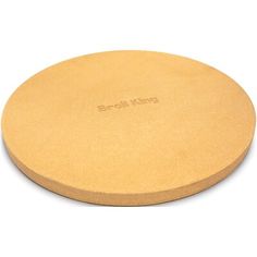 a round cutting board with the word broil king on it