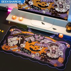 an image of halloween themed area rugs on the floor in front of a computer