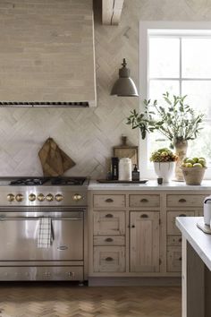 a kitchen with an oven, stove and counter top