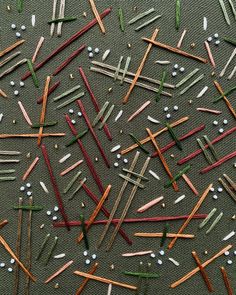 many different colored toothpicks are scattered together