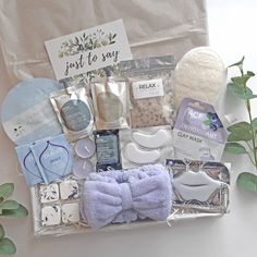 the contents of a baby gift box are laid out