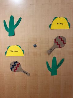 the door is decorated with paper cutouts and cactus hats