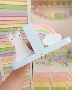 Beautiful new addition to our unicorn range, these bookends are chunky and ever so pretty. Perfectly pastel of course, with a soft duck egg blue base to the rainbow/unicorn option, and bubblegum pink for the unicorn duo. The cloud on the rainbow bookends is glittered with iridescent glitter adding that extra bit of magic.  These are as pretty as they look, and are a stunning addition to any shelf. Perfect for bedrooms, nurseries and playrooms- these will look darling anywhere. Each bookend measu Unicorn And Rainbow Bedroom Ideas, Unicorn Bookshelf, Rainbow And Unicorn Bedroom, Rainbow Bookends, Pastel Rainbow Room, Unicorn Furniture, Pastel Kids Room, Unicorn House, Soft Pfp