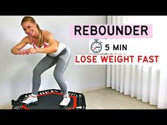 a woman standing on top of an exercise mat