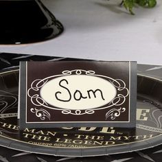 a black and white plate with a sign on it that says som in the center