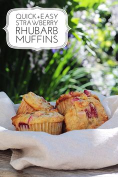 three muffins sitting on top of a white cloth