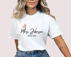 a woman wearing a white t - shirt with the words mrs johnson on it