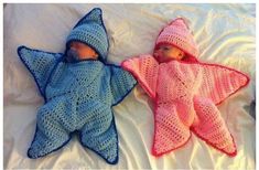 two crocheted stars laying next to each other on a bed