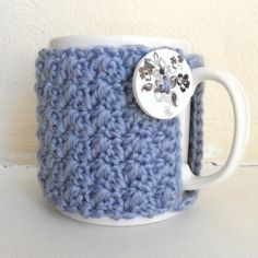 2Stitch Mug Cozy Crochet pattern by Claire Preston   Knitting Patterns  LoveCrafts Mug Cozy Crochet Pattern, Mug Cozy Crochet, Sew Ideas, Crochet Mug Cozy, Crochet Mug, Crochet Cup Cozy, Dog Crochet, Coffee Cup Cozy, Cozy Crochet Patterns