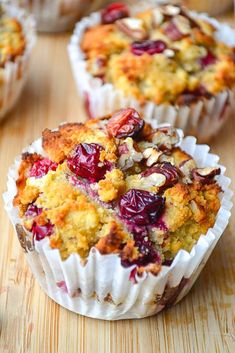 cranberry orange and pecan muffins on a wooden table with text overlay