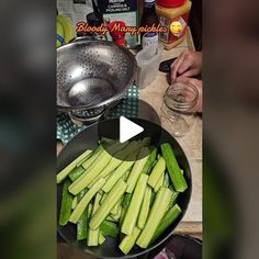 a bowl filled with cut up celery on top of a counter next to a colander