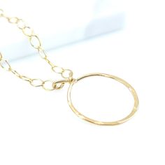 A dainty and delicate hammered circle necklace - so light around the neck that you will forget you are wearing it! A perfect everyday accessory. MATERIALGold filled chainGold filled wire and componentsSIZE16-inch chain18mm circle pendantCLOSURELobster claspWHAT IS GOLD FILLED?We used to have just 2 choices: pure gold or gold plated. The first was very expensive, and the second was…well…not very good.Our gold filled jewelry is designed to last you a lifetime without the price of solid gold pieces Everyday Round Charm Necklace With Cable Chain, Minimalist Circle Cable Chain Jewelry, Everyday Circle Charm Necklaces With Adjustable Chain, Minimalist Chain Necklace With Lobster Clasp, Everyday Circular Cable Chain Necklace, Minimalist Circle Chain Necklace With Adjustable Chain, Minimalist Round Necklace With Rolo Chain, Dainty Circle Charm Necklace With Adjustable Chain, Delicate Round Necklace With Lobster Clasp