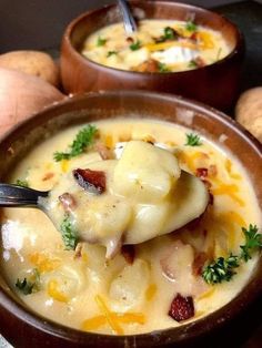 two brown bowls filled with soup and potatoes