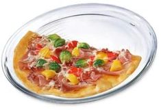 a pizza sitting on top of a glass plate