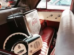 an old fashioned radio sitting in the back seat of a car