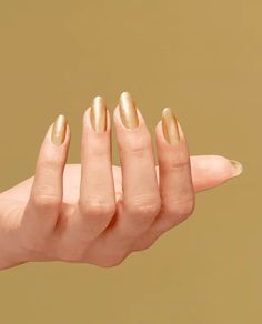 A long-lasting nail polish in a gel-like metallic gold finish that blings it on and on and on. This is your golden ticket to long-lasting nail polish. Meet our shiniest finish ever in a gel-like metallic gold hue that blings it on and on and on. Major color vibrancy that’s gilt tough for up to 11 days of wear will leave everyone wondering if it’s the real deal. Gel the truth: it’s Infinite Shine. Golden Nail Polish, Interview Nails, Nail Polish Gift Set, Kiara Sky Gel Polish, Nail Polish Gift, Metallic Nail Polish, Golden Nails, Gold Nail Polish, Cat Eye Gel Polish