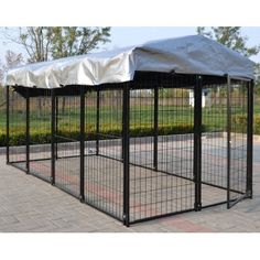 a black dog kennel with a white cover on top