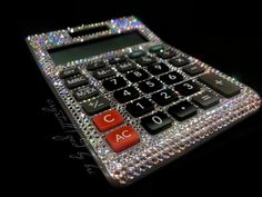 a calculator that has been decorated with many different colors and numbers on it