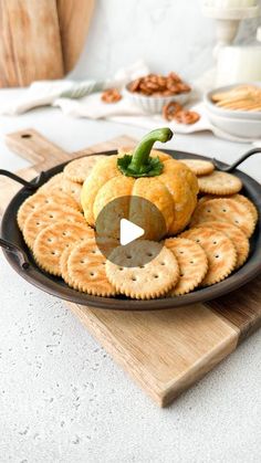 a plate with crackers and pumpkins on it