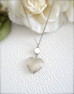 Gift Wrapping Available!! Our shop offers unique gift wrapping on all our items. Make any purchase a special gift for a loved one for an extra $5 US ❤️  Heart Locket Necklace, Heart Pendant, Small Locket, Dainty Heart Necklace, Wedding Jewelry, Layering Necklace, Round Disc Necklace, Gift for Her  Beautiful heart shaped silver locket, adorned with lovely white enamel round disc charm. The locket hangs from 28 inches long silver chain. The locket is quite small and opens to reveal two compartments ready to be fitted with your favorite mementos or pictures. This lovely locket necklace is very pretty and beautiful! It looks cute alone, but also looks great if you layer with other pieces. Romantic and beautiful, stunning gift for a girlfriend, wife, daughter, sister, mother, bridesmaid or any Locket Necklace Heart, Jewelry Layering Necklace, Dainty Heart Necklace, Jewelry Layering, Unique Gift Wrapping, Silver Locket, Heart Locket Necklace, Travel Jewelry Box, Mixed Metal Jewelry