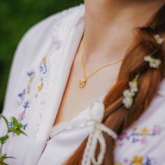 Lemon Necklace with a small lemon pendant look very nice. It can be worn with other 18k gold simple chains. This lemon necklace is fruit jewelry from Selenichast jewelry store.
 A delicate golden necklace that is adorned with lifelike lemon slice pendant gives us delight in its bucolic atmosphere. An enamelled lemon slice dotted with green leaves in its right hand corner presents unspeakable loveliness and agreeable sweetness. A clever choice for women to light up everyday outfits. 
 DETAILS Delicate Yellow Necklace For Gift, Dainty Yellow Pendant Jewelry, Delicate Yellow Gold Pendant Charm Necklace, Dainty Yellow Necklace For Gift, Dainty Yellow Necklace For Gifts, Elegant Yellow Charm Necklace For Gift, Elegant Yellow Charm Necklaces For Gifts, Yellow Flower Pendant Necklace For Weddings, Dainty Yellow Charm Necklace For Gifts