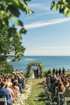 an outdoor wedding ceremony overlooking the ocean