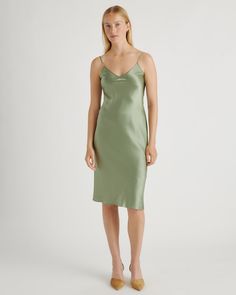 We love the midi length and bias cut of this dress! This super flattering fit is made from 100% mulberry silk, in a satin finish. The kicker? Our silk is washable. Easy to style, easy to wash for low-maintenance luxe. Plus, silk fiber contains 18 kinds of amino acids that make it amazing for skin nourishment, hypo-allergenic, and naturally thermoregulating to help maintain body temperature. Summer V-neck Modal Satin Midi Dress, Sleek Satin V-neck Midi Dress, Green Midi Dress With Bias Cut For Night Out, Green Bias Cut Midi Dress For Night Out, Knee-length Bias Cut Dress For Date Night, Bias Cut Knee-length Dress For Date Night, Sleek Silk Dress With Bias Cut V-neck, Fitted Knee-length Bias Cut Satin Dress, Fitted Knee-length Satin Dress With Bias Cut