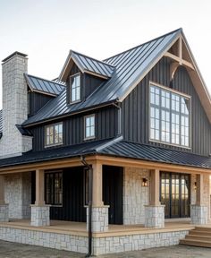 a black and white house with lots of windows