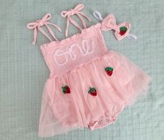 This adorable tutu romper with matching headband is the perfect outfit to celebrate a first birthday! Or a sweet gift that will make an adorable keepsake :) Hand embroidered romper with name in the color(s) of your choice.  To personalize: Please type name in box along with color choice and double check spelling!  The font and size shown in pictures will vary slightly depending on name so please understand no 2 rompers are the same.  For any questions, we are happy to help, simply send us a mess Sweet Summer Tutu Dress, Sweet Summer Tutu Dress For First Birthday, Cute Summer Tutu Dress For Cake Smash, Fitted Tutu Dress For First Birthday In Summer, Cute Pink Tutu Dress For First Birthday, Pink Tutu Dress For First Birthday In Summer, Sweet Tutu Dress For Cake Smash In Summer, Sweet Tutu Dress For Cake Smash, Cute Spring Tutu Dress For Cake Smash