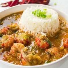 a white bowl filled with shrimp and rice