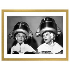 “1950s Two Women Sitting Together Gossiping Under Hairdresser Hair Dryer” by Vintage Images shows a black and white photo of two women mid-conversation sitting under hair dryers with towels draped over their shoulders. This print can bring a dose of friendship and femininity to any space. A great pick for someone looking to create a vintage atmosphere.Vintage Images’ canvas art arrives ready to hang and looks nice with or without a frame. This hand-crafted canvas print can bring fresh life to yo Vintage Hair Dryer, Vintage Hair Salons, 1950s Women, Kitsch Art, Retro Space, Beauty Parlor, Images Vintage, Beauty School, White Photo