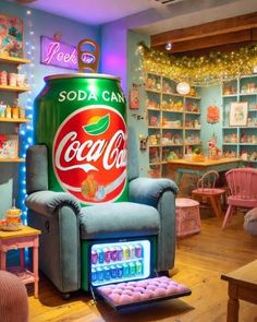 a soda can sitting on top of a blue chair in a room filled with furniture