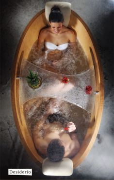 a man and woman are sitting in a bathtub