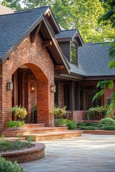 a brick house with landscaping around it