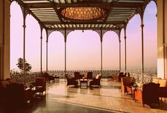 an ornate covered patio with chairs and tables