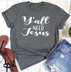 "Y'all need Jesus SHIRT, Christian Shirt, Funny Tee, Womens Tee, Gift for Her, Christian Shirt, Christian Tee, Religious Shirt HOW TO ORDER 1. Select the shirt \"Style and Size\" 2.Select the shirt Color 3. Enter what would you like to say on your t shirt and LETTERING color 4.Select the quantity. 5. Click Add to cart. If you have any difficulties, send us a message. Processing Time and Shipping The standard processing time is 1-3 business days. We usually proses and ship out the orders the next Y’all Need Jesus Shirt, Faith Tee Shirts, Christian Shirts Funny, Tshirt Printing Business, You Need Jesus, Tee Ideas, Christian Shirts Designs, Cute Bibles, Jesus Funny