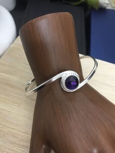 A simplistic and elegant sterling silver bracelet cuff, with an 8mm gemstone cabochon of your choosing in the drop down menu! This is shown with a few different stone colors and I can accommodate if preferred. Also, when ordering, please tell me your wrist size so I can have this fit you perfectly! Shipping is First Class with Delivery Confirmation, within the US, and First Class International outside. *SIZING GUIDE* Take a snug wrist measurement and add 1 inch to determine which size to order. Sterling Silver Bangle With Gemstone, Elegant Silver Amethyst Bangle, Elegant Sterling Silver Gemstone Cuff Bracelet, Elegant Silver Amethyst Cuff Bracelet, Elegant Sterling Silver Round Amethyst Bracelet, Elegant Round Amethyst Sterling Silver Bracelet, Adjustable Amethyst Sterling Silver Bracelet, Swirl Bracelet, Silver Bracelet Cuff