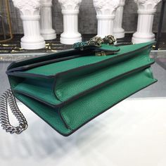 Description GG Dionysus Shoulder Bag Emerald Green Metal-Free Tanned For Women 11in/28cm GG 400249 CAOGX 3120 Rep 1:1 Measurements: 28 x 11 x 17 cm / 11 x 7 x 3.5 inches ( Length x Width x Height ) The Dionysus shoulder bag with the now defining tiger head closure-a unique detail referencing the Greek god Dionysus, who in myth is said to have crossed the river Tigris on a tiger sent to him by Zeus. The closure is further enhanced with black crystals. The sliding chain strap can be worn multiple God Dionysus, Green Metal, Gucci Bamboo, Greek God, Stylish Handbags, Gucci Shoulder Bag, Tiger Head, Luxury Products, A Tiger