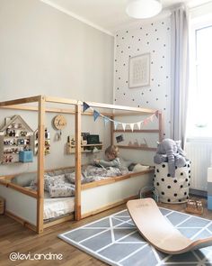 a child's bedroom with bunk beds and toys