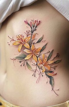 a woman's stomach with yellow flowers on it