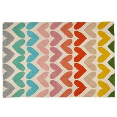 a multicolored rug with wavy shapes