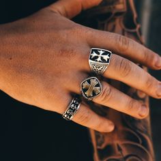 Introducing the Crusader's Ring—a powerful union of silver and brass, embodying valor and virtue. This ring is not merely an ornament; it's a bastion of belief, a symbol of the courage that guides those who wear it. With its layered cross design, it's a modern relic that speaks to the soul's journey through trials and triumphs. The ring features a bold, brass cross, its textured surface catching the light and the eye, nestled into a bed of blackened silver. This contrast is no coincidence; it's Symbolic Antique Finish Ring Jewelry, Symbolic Antique Finish Ring, Silver Brass Promise Jewelry, Silver Brass Jewelry For Promise, Symbolic Promise Jewelry With Polished Finish, Symbolic Bronze Metal Ring Jewelry, Symbolic Bronze Jewelry With Metal Ring, Silver Antique Finish Rings, Silver Rings With Antique Finish