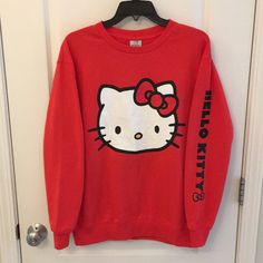 Nwot Crewneck Sweatshirt Has Fluffy Fleece Inside It That Keeps You Nice And Warm! Has Hello Kitty With A Cute Little Bow Printed On The Left Arm. Right Arm Has Nothing On It! Disclaimer: After The Bow On The Left Arm There Is A Mini Black Smear Not Sure If It Is Removable (Small Dirty Spot) In The Wash Or If It Is From The Printing. See Photo Of Me Pointing At It For Details. I Have Another Hello Kitty Crewneck That Is Off-White With Cute Little Daisies!! Size M But Works As An Oversized S, If Hello Kity Sweater, Cute Hello Kitty Print Crew Neck Sweatshirt, Trendy Hello Kitty Print Crew Neck Sweatshirt, Hello Kitty Print Crew Neck Cotton Sweatshirt, Cotton Crew Neck Sweatshirt With Hello Kitty Print, Cute Long Sleeve Hello Kitty Sweatshirt, Casual Crew Neck Sweatshirt With Hello Kitty Print, Cute Red Crew Neck Sweater, Casual Hello Kitty Print Crew Neck Sweatshirt