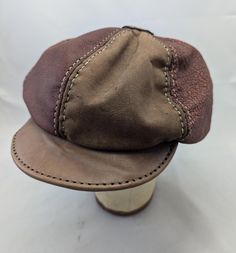 Handmade and hand stitched six panel Leather newsboy hat in maroon and tan.  Hat is sized at 23.6 inches on the inside with a little stretch.  If you have any questions please message before purchase. Tan Hat, Newsboy Hat, News Boy Hat, Berets, Hand Stitched, Hand Stitching, 6 Inches, Caps Hats, Accessories Hats