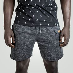 Elevate your style and experience unmatched comfort with our Urban Comfort Gray Mélange Terry Shorts. Meticulously crafted for both fashion and function, these shorts are designed to be your go-to choice for casual sophistication. Immerse yourself in the luxurious comfort of our 100% cotton Terry cloth fabric. The Gray mélange color adds an urban edge to your wardrobe, ensuring versatility for various occasions. With a regular men's fit and an adjustable drawstring waist, these shorts provide the perfect balance between relaxed style and personalized comfort. Featuring multiple pockets, including a unique mini coin pocket adorned with our iconic Eternce logo, these shorts offer practicality and a touch of luxury. Experience breathability and moisture-wicking properties in the fabric, keepi Urban Sophistication, Comfort Gray, French Terry Shorts, Men Fits, Terry Cloth, Relaxed Style, Casual Wardrobe, Urban Fashion, Cotton Shorts