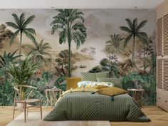 a bedroom with palm trees on the wall and green bedspread in front of it