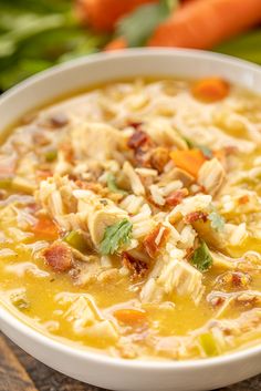 a white bowl filled with chicken and rice soup