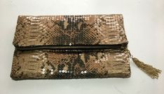 "Sequin fold over clutch bag has an exotic snake print overlaid with clear sequins. This glam animal print custom handbag will be the perfect gift for her.   Wedding handbag or party purse is stylish and add a high-end look to any attire casual and dressy for any fashion girl, with this one of a kind handbag.     Evening bag measures 7\" H x 11\" W x 1/2\" D folded, 11\" H (unfolded).  A bold tangerine satin interior features an 8\" zipper pocket and 6\" open pocket adds a dramatic \"pop\" of co Animal Print Wedding, Snake Print Bag, Wedding Handbag, Custom Handbags, Sequin Clutch, Foldover Clutch, Fur Bag, Wedding Purse, Party Purse