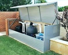 an outdoor storage unit with water tanks and other items in it's back yard